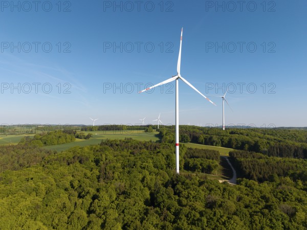 Single wind turbine in the middle of forest and fields under a clear sky, near Westerheim, Swabian Alb, Baden-Württemberg, Germany