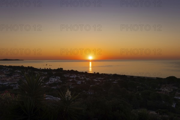 The sun rises on the Costa Rei, a stretch of coastline on the Italian Mediterranean island of Sardinia, Monte Nai, Costa Rei, Sardinia, Italy