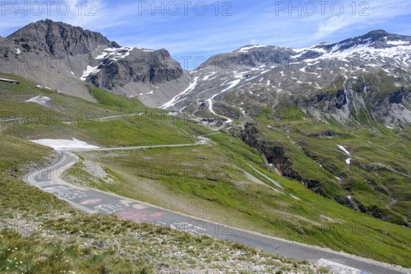 View of last section part of mountain road pass road alpine road above above tree line shortly in front of pass summit of highest asphalted two-sided passable alpine pass Col de l'Iseran, departmental road D902, Route des Grandes Alpes, Département Savoie, Region Auvergne-Rhône-Alpes, Graian Alps, France