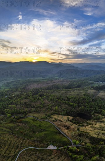 Panorama of Sunset over Mountains and Coniston Water from drone, Lake District National Park, Cumbria, England, United Kingdom