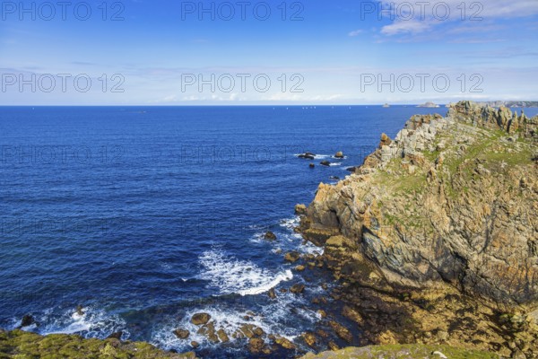 Rocky coast with a scenics sea view towards the horizon a sunny summer day by the sea, Crozon peninsula, Bretagne, France