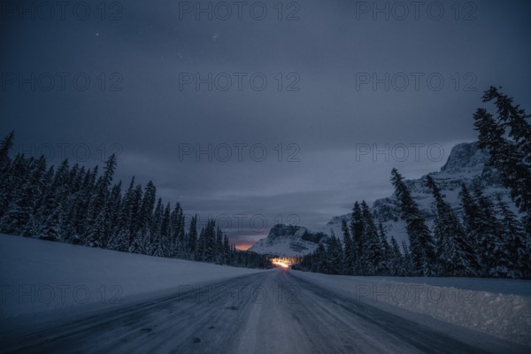 Starry sky during a winter road trip on the Icefields Parkway with lots of snow and ice, Banff National Park, Jasper National Park, Alberta, Canada