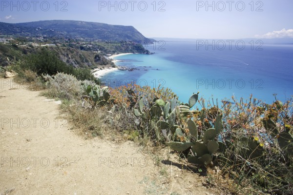 Coastal path with a view of the wide blue sea and coastal landscape, Ricadi, Capo Vaticano