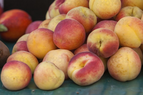 Fresh peaches on a market stall, market sale, Provence, France