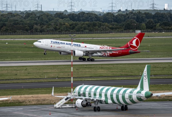 Düsseldorf Airport, Condor Airbus A321-200, aircraft on the apron, Turkish Airlines Airbus A330-200 taking off, North Rhine-Westphalia, Germany