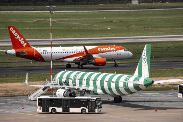 Düsseldorf Airport, Condor Airbus A321-200, aircraft on the apron, EasyJet Airbus A320-200 taxiing for take-off, North Rhine-Westphalia, Germany