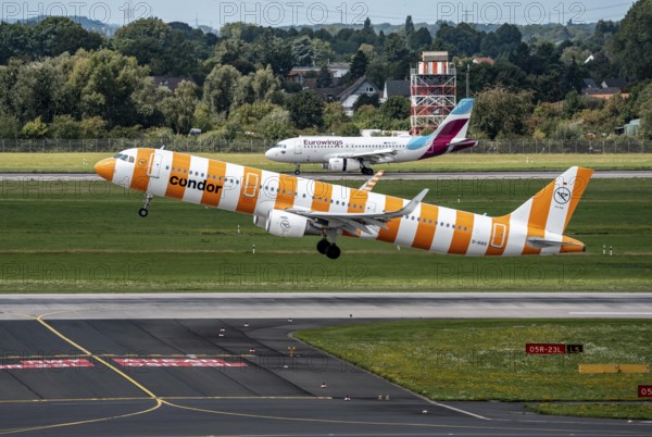 Düsseldorf Airport, Condor Airbus A321-211 on take-off, Eurowings Airbus aircraft after landing, North Rhine-Westphalia, Germany