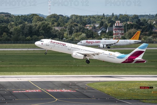 Düsseldorf Airport, Eurowings Airbus A321-231 on take-off, Flypgs.com, Pegasus aircraft after landing, North Rhine-Westphalia, Germany