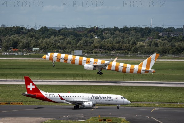 Düsseldorf Airport, Condor Boeing 757-330 on take-off, Helvetic Airways Embraer E190LR on the way to take-off, North Rhine-Westphalia, Germany