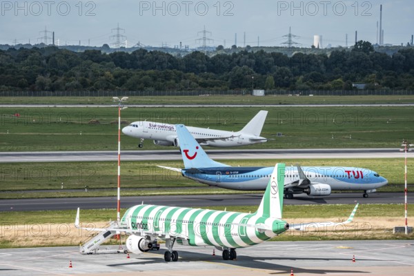 Düsseldorf Airport, Condor Airbus A321-200, aircraft on the apron, TUIFly Boeing 737 on the way to take-off, Eurowings Airbus on take-off, North Rhine-Westphalia, Germany