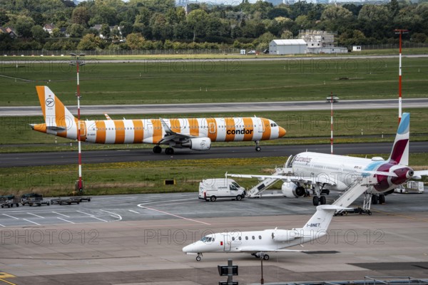 Düsseldorf Airport, Condor Airbus aircraft on the apron, Eurowings Airbus, private aircraft Cessna Citation VII, Airline Aliserio on the way to take-off, North Rhine-Westphalia, Germany