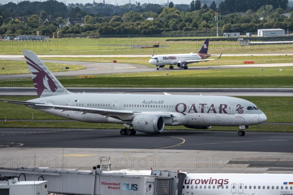 Düsseldorf Airport, Qatar Boeing 787-8 Dreamliner on the way to take-off, Air Cairo aircraft after landing, North Rhine-Westphalia, Germany