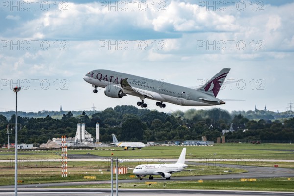 Düsseldorf Airport, Qatar Boeing 787-8 Dreamliner on take-off, Eurowings Airbus aircraft after landing, North Rhine-Westphalia, Germany