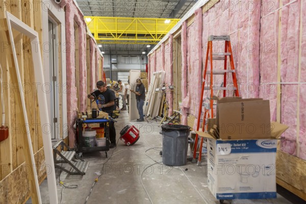 Romulus, Michigan - Workers build apartments in Ginosko Modular 's factory using modular construction methods. The units will be assembled into an apartment building in Detroit for low to moderate income households