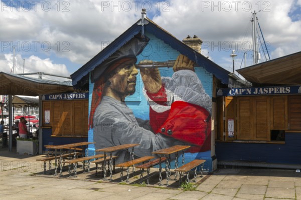 Pirate mural painted on wall at Cap'n Jaspers cafe, The Barbican, Plymouth, Devon, England, UK artwork by Joe Greenaway Art