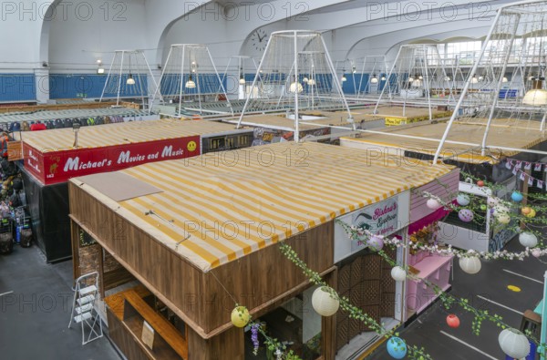 Raised view over roofs of market stalls in Market Building or Pannier Market, city of Plymouth, Devon, England, UK
