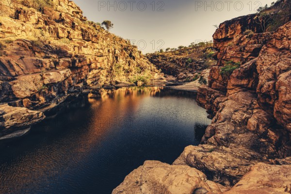 Bell Gorge waterfall, a body of water in north-west Australia in the Kimberley. Sunrise in the outback, Australia