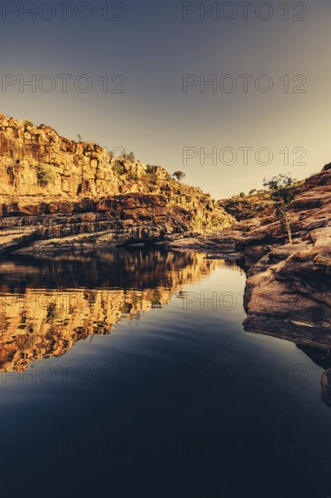 Bell Gorge waterfall, a body of water in north-west Australia in the Kimberley. Sunrise in the outback, Australia