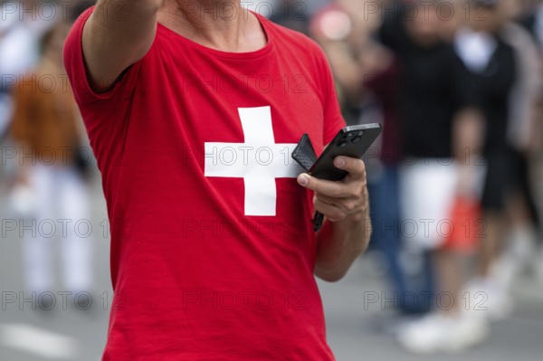 Symbol photo Mr Swiss with mobile phone, Interlaken, Bern, Switzerland