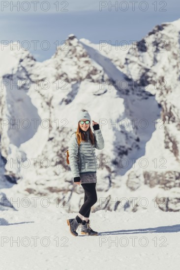 Woman in wintry surroundings in the Engadine in Switzerland