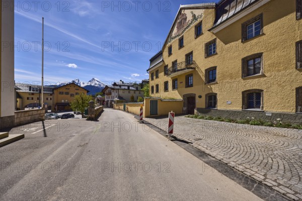 Historical buildings, general architecture, barrier beacons, facade, windows, flagpoles, mountain landscape, mountains, road, asphalt, blue sky, cirrostratus clouds, Doktorberg, town hall square, Berchtesgaden, Upper Bavaria, district Berchtesgadener Land, Bavaria, Germany