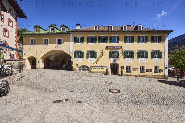 Gasthof Neuhaus, pedestrian zone, square, cobblestones, historic buildings, drive-through arch, blue sky, market square, Berchtesgaden, Upper Bavaria, Berchtesgadener Land district, Bavaria, Germany