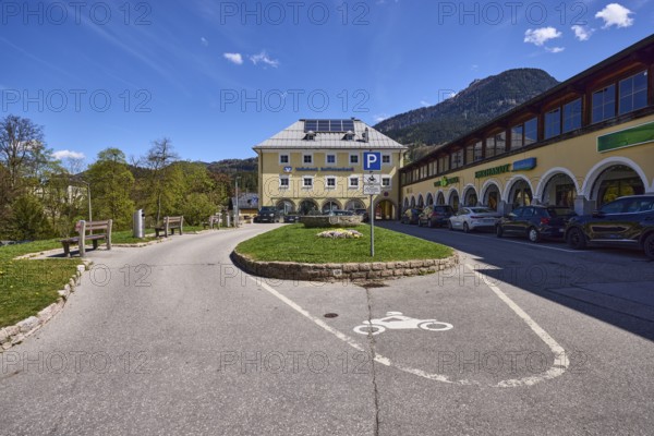 Volksbank Raiffeisenbank Oberbayern Südost eG, car park, motorbike parking, benches, commercial building, lawn, mountain landscape, mountains, forest, trees, blue sky, cumulus clouds, cirrostratus clouds, Am Fischerbichl, Bahnhofstraße, Berchtesgaden, Upper Bavaria, Berchtesgadener Land district, Bavaria, Germany