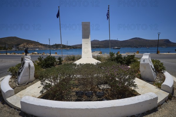 War memorial, A memorial with geometric shape, two flags and view of the sea and mountains, photos related to WW2, Battle of Leros, Leros, Dodecanese, Greek Islands, Greece