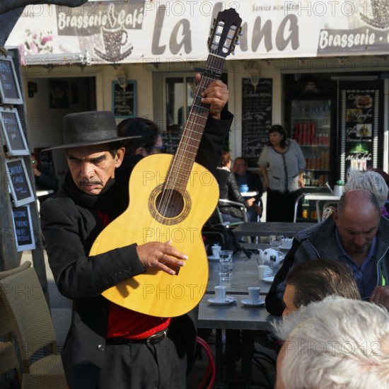 Traditional guitar player, singer in a restaurant, pilgrimage in Saintes-Maries-de-la-Mer, Camargue, France