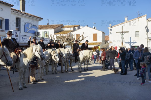 Guardians of the Camargue, traditional shepherds, riders on Camargue horses, spectators, pilgrimage, procession in Saintes-Maries-de-la-Mer, Camargue, France