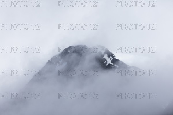 Mountain peak in the fog, Bamsebu, Spitsbergen, Svalbard