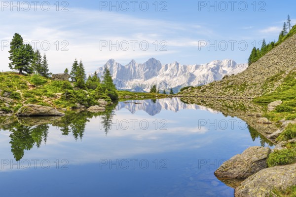 Mirror lake with view to the Dachstein, reflection, mountains, Dachstein massif, Reiteralm, Schladming, Styria, Austria
