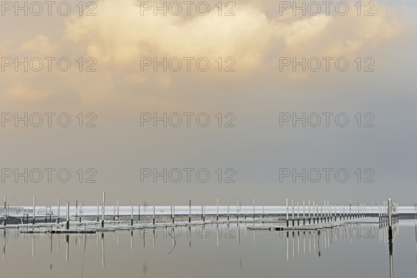 Winter day, onset of winter, snow on the jetties in the marina, North Sea, Norddeich, Lower Saxony, Germany