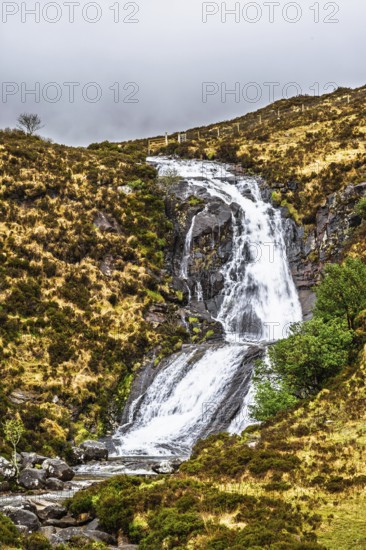 Eas a' Bhradain waterfall, Red Cuillin mountains, Loch Ainort, Isle of Skye, Scotland, UK