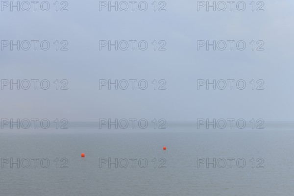 North Sea, two red buoys in the Wadden Sea, Norddeich, Lower Saxony, Germany