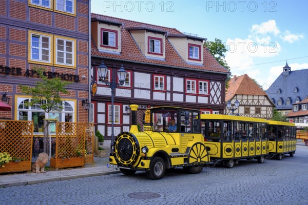 Market street with city train Wernigerode Bimmelbahn, to the castle, Wernigerode, Harz, Saxony-Anhalt, Germany