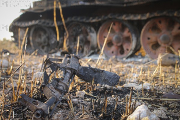 Destroyed gun on the roadside after its owner was killed by airplane bombing in Syria