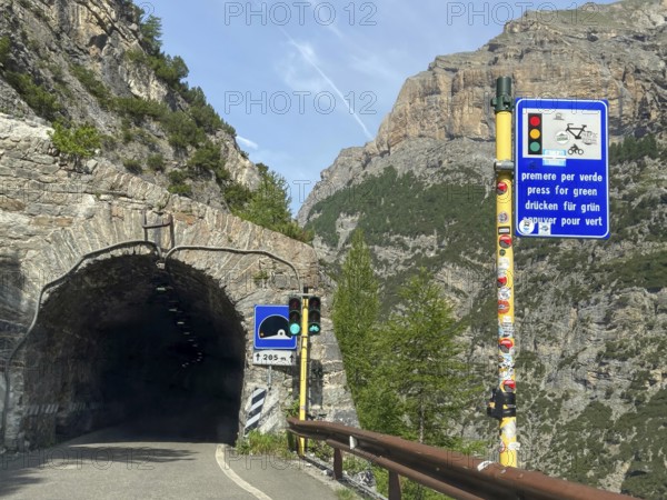 Demand traffic light in front of Galleria Diroccamento tunnel from 1928 on south-west ramp departure from Stelvio Stelvio Pass, Bormio, Sondrio, Lombardy, Italy