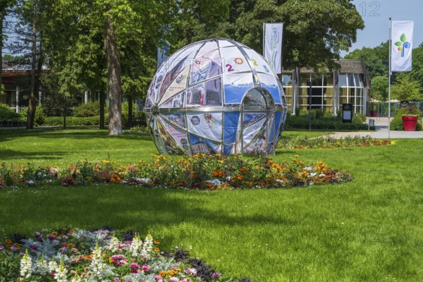 Park in front of the entrance to the garden show, globe, Bad Lippspringe, climatic health resort, Westphalia, North Rhine-Westphalia, Germany