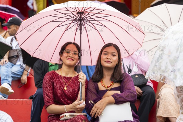 People from the Pnar community attend the Behdienkhlam festival in Jowai, India on July 14, 2025. Behdienkhlam is a vibrant annual festival celebrated by the Pnar (Jaintia) community of Meghalaya, especially in Jowai, to drive away plague and diseases and to pray for a good harvest. Observed in July after the sowing season, it features traditional rituals, offerings to ancestral spirits, and the grand procession of beautifully decorated bamboo structures called rots, which are later immersed in a sacred muddy pool known as Ka Aitnar