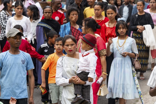 JOWAI, INDIA - JULY 14: People from the Pnar community attend the Behdienkhlam festival in Jowai, India on July 14, 2025. Behdienkhlam is a vibrant annual festival celebrated by the Pnar (Jaintia) community of Meghalaya, especially in Jowai, to drive away plague and diseases and to pray for a good harvest. Observed in July after the sowing season, it features traditional rituals, offerings to ancestral spirits, and the grand procession of beautifully decorated bamboo structures called rots, which are later immersed in a sacred muddy pool known as Ka Aitnar