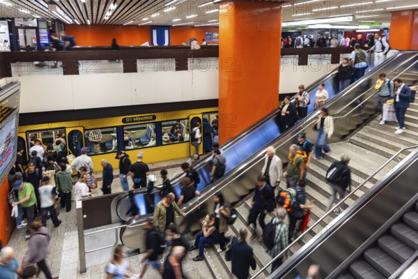 Light rail stop at Stuttgart main station. Platform with many people. Motion blur. Stuttgart, Baden-Württemberg, Germany