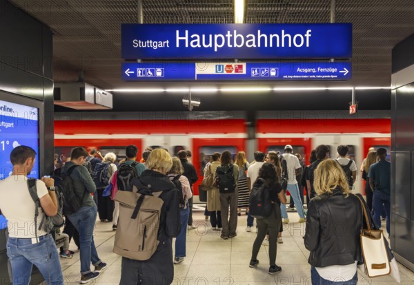 Stuttgart main station with S-Bahn. People on the platform waiting for their train. Stuttgart, Baden-Württemberg, Germany