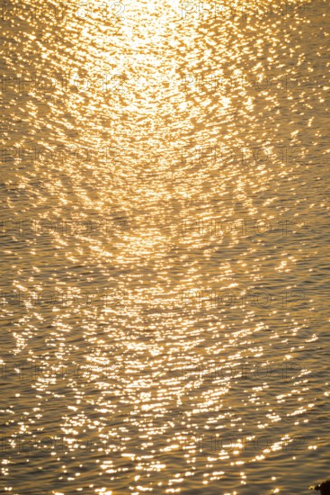 Olden sunlight is reflected by the water surface of the North Sea, natural glow, glow, highlights on small waves, reflection, light reflection, evening light, sunset, atmosphere, atmospheric, illuminated, bright, waters, no people, light, light reflections, light reflection, light reflection, deserted, nobody, reflection, mirror, reflection, mood, atmospheric, harbour, island dune, Heligoland, Schleswig-Holstein, North Sea, Germany