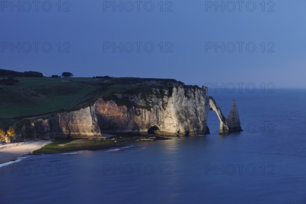 Cliffs with the Falaise d'Aval rock gate and the Aiguille d'Etretat rock needle at night, Etretat, Alabaster Coast, Seine-Maritime, Normandy, France