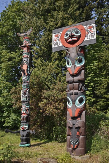 Totem poles, Chief Skedans Mortuary Totem Pole and Ga'akstalas Totem Pole, Stanley Park, Vancouver, British Columbia, Canada