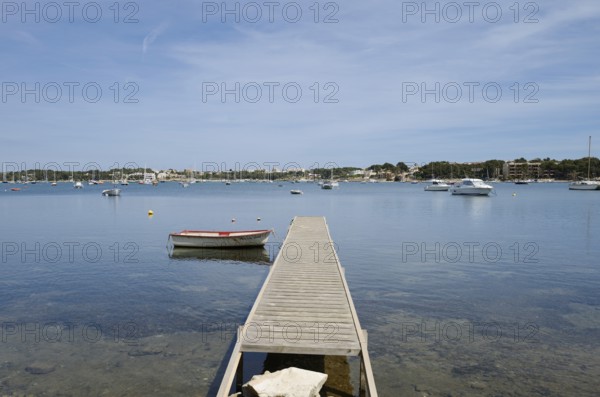 Wooden jetty and boats in the harbour, Porto Colom, Majorca, Balearic Islands, Spain