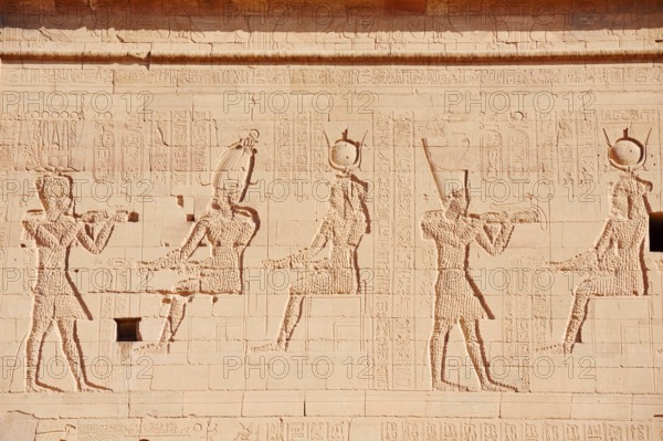Relief of the king in front of the gods Osiris-Onophris and Isis and the king in front of the gods Isis and Horus, Temple of Philae, Aswan, Egypt