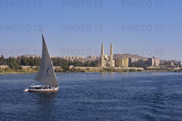 Felucca on the Nile in front of the El-Tabia Mosque, Aswan, Egypt