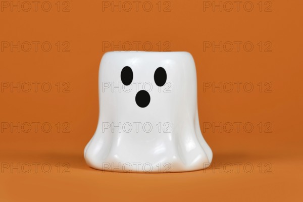 Cute white Halloween ghost candle ornament on orange background